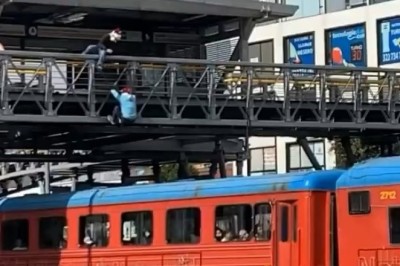 Santa Hat Daredevils Take On A Moving Train – Epic Stunt Shocks Bogotá!