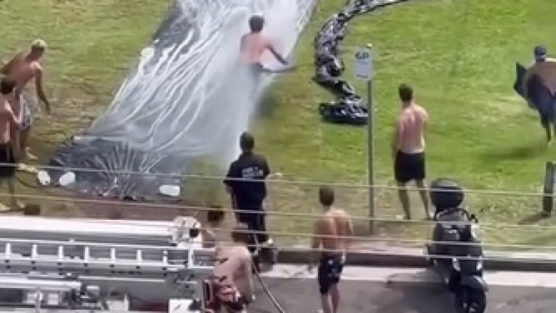 Firefighters Bring Joy and Relief to Sydney Locals with Waterslide Fun Amid a Heatwave