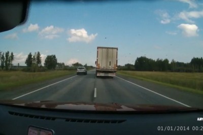 Truck Wedges Car on Road: Unbelievable Stunt Gone Wrong!